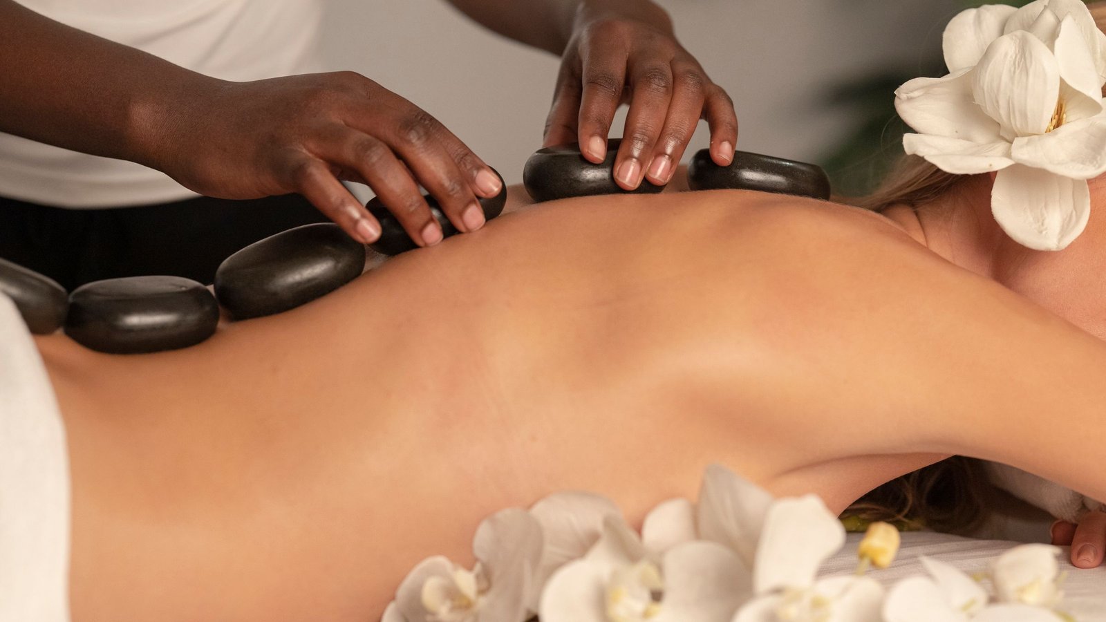 Professional hot stone massage treatment in a calm spa setting